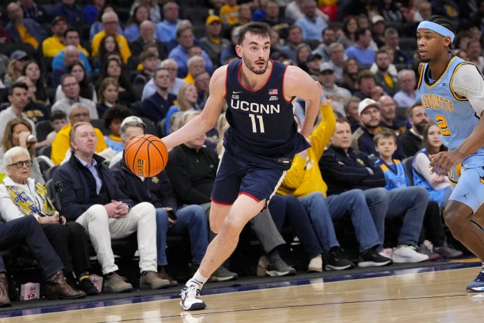 UConn wing Alex Karaban drives against Marquette during the 2025-26 college basketball season.
