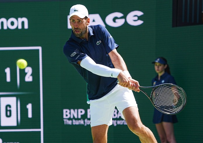 Novak Djokovic hits a backhand against Aleksandar Kovacevic at the 2026 BNP Paribas Open in Indian Wells.