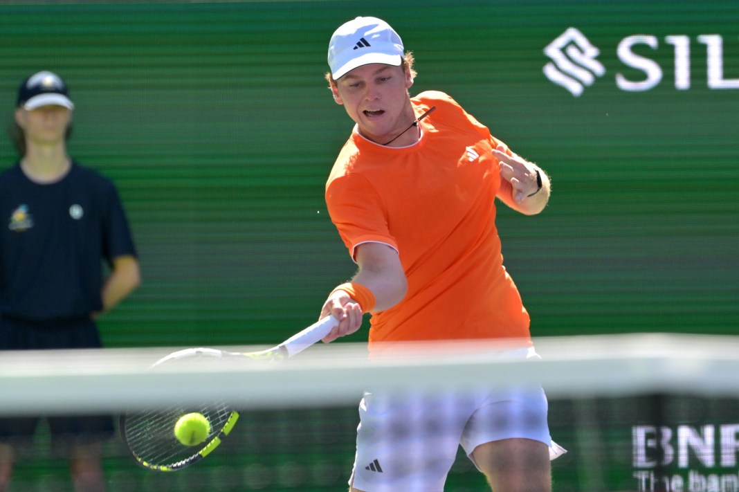 Alex Michelsen hits a forehand against Daniil Medvedev at the 2026 BNP Paribas Open in Indian Wells.