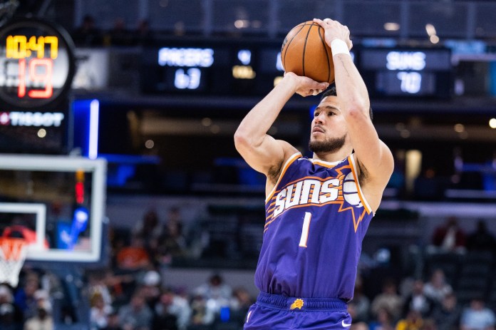 Suns superstar Devin Booker takes a shot against the Pacers during the 2025-26 NBA season.