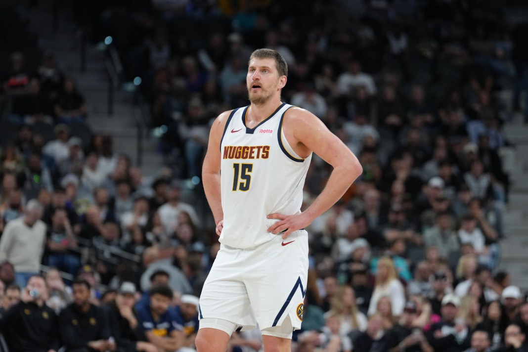 Nuggets superstar Nikola Jokic looks on against the Spurs during the 2025-26 NBA season.