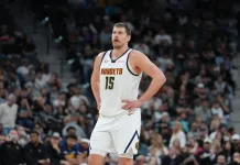NBA Predictions Today: Best Bets and Player Props for Saturday, March 14 Nuggets superstar Nikola Jokic looks on against the Spurs during the 2025-26 NBA season.