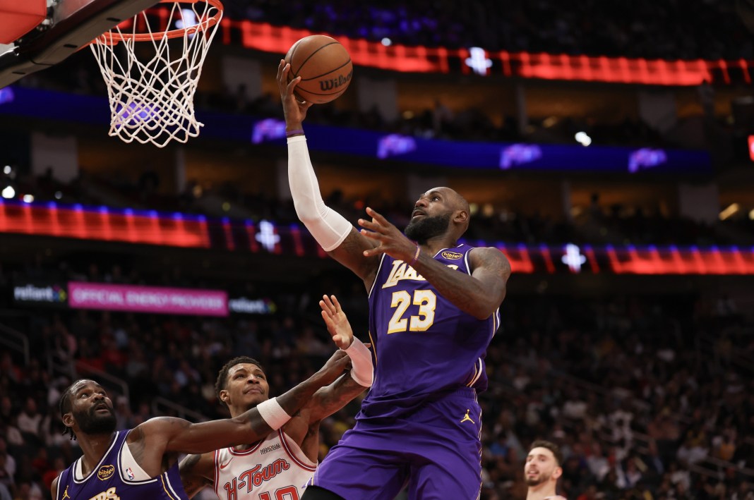 Lakers star LeBron James makes a layup against the Rockets during the 2025-26 NBA season.