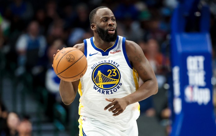 Warriors star Draymond Green brings the ball up against the Mavericks during the 2025-26 NBA season.