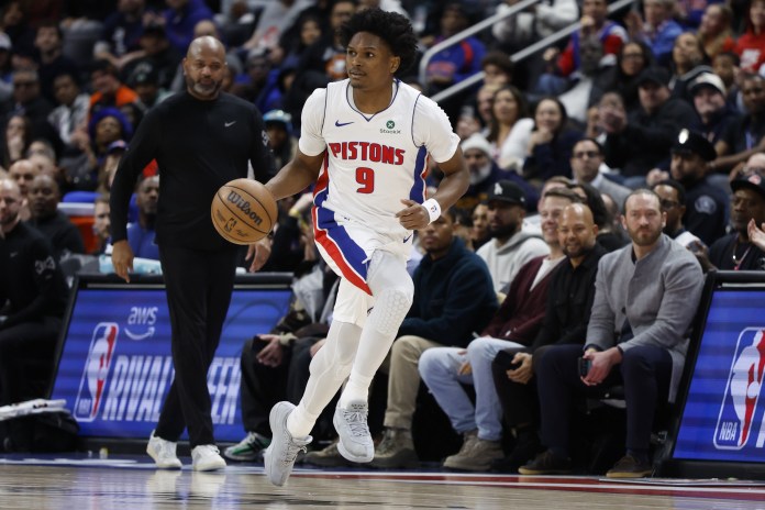 Pistons wing Ausar Thompson brings the ball up against the Celtics during the 2025-26 NBA season.