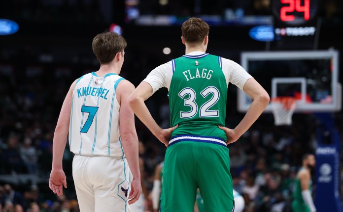 Hornets rookie Kon Knueppel and Mavericks rookie Cooper Flagg stand in a meeting during the 2025-26 NBA season.