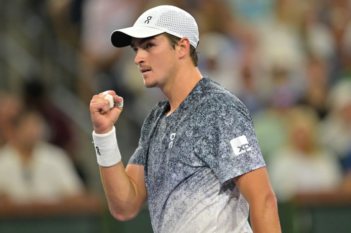 Joao Fonseca celebrates a point against Jannik Sinner during the 2026 BNP Paribas Open in Indian Wells.