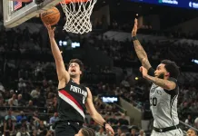 2025-26 NBA Playoffs Predictions Today: Best Bets and Player Props – April 19 Blazers All-Star Deni Avdija goes to the basket against the Spurs in the 2025-26 NBA season.