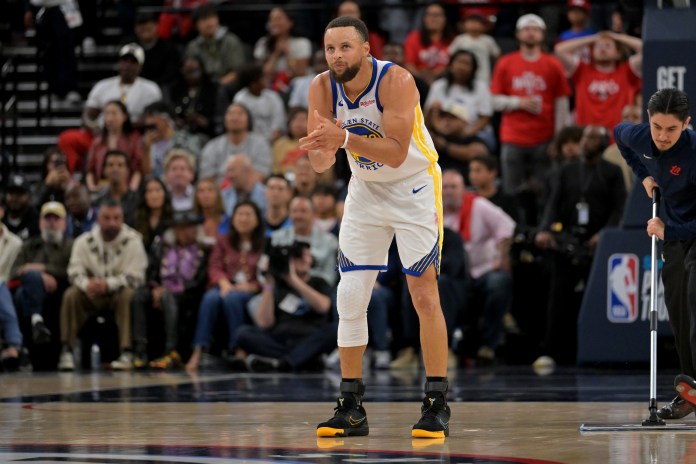 Warriors star Stephen Curry celebrates a play against the Clippers during the 2025-26 NBA Play-In Tournament.