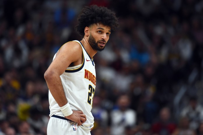 Nuggets star Jamal Murray looks on against the Timberwolves during the 2025-26 NBA Playoffs.