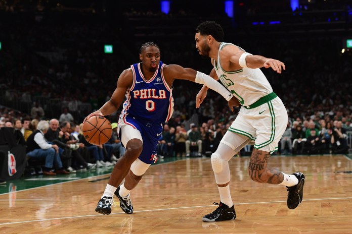Sixers star Tyrese Maxey drives on Jayson Tatum during the 2025-26 NBA Playoffs.