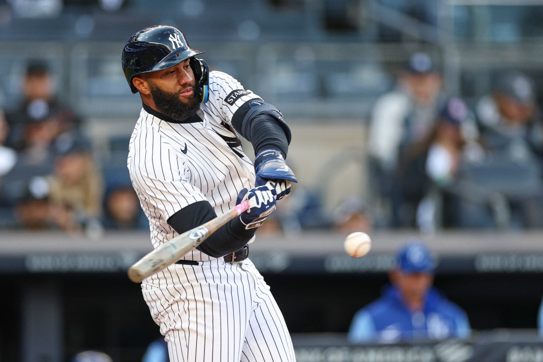 Yankees third baseman Amed Rosario hits against the Royals during the 2026 MLB season.