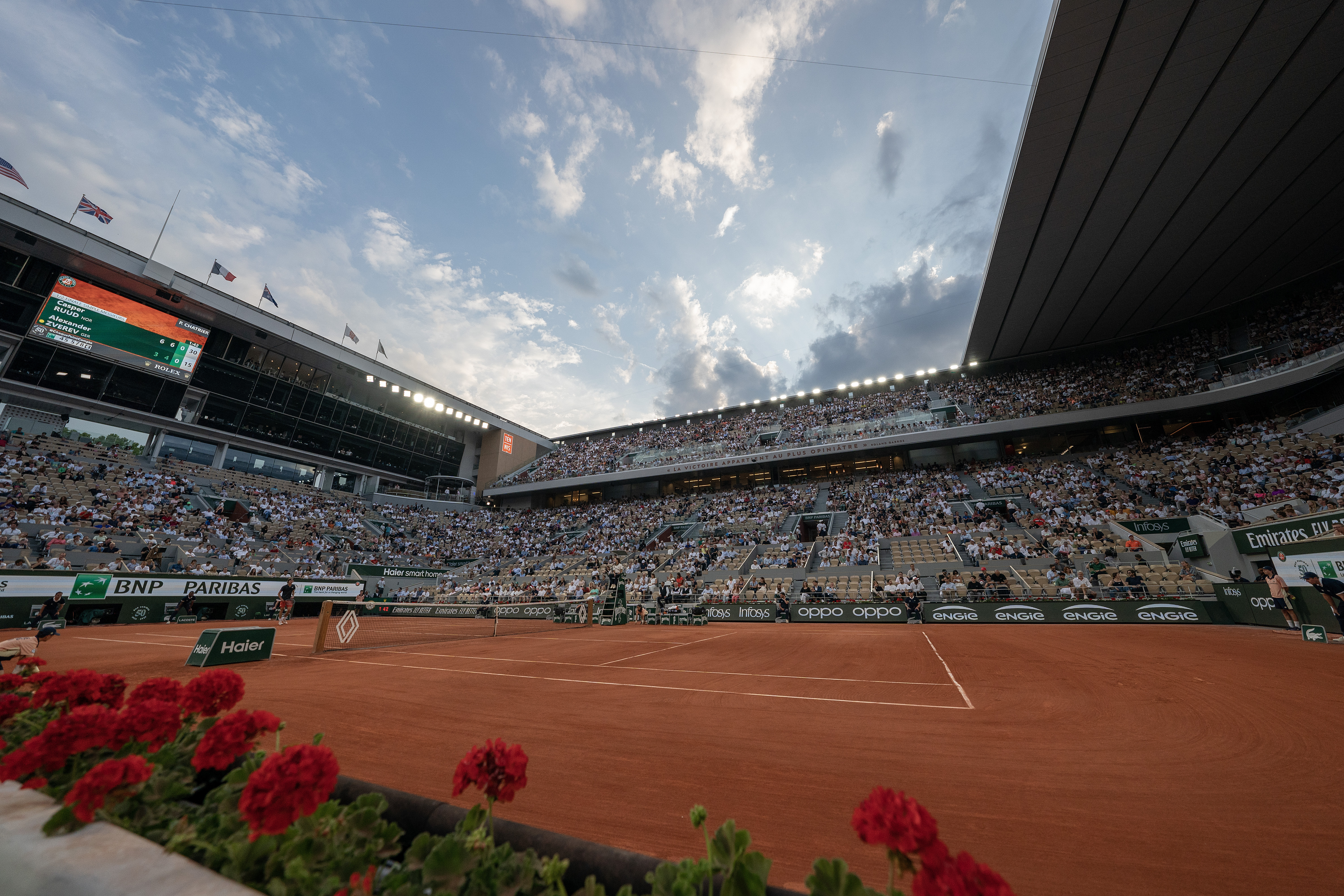 Philippe-Chatrier Court at Roland Garros with the clay court and stadium under an open sky