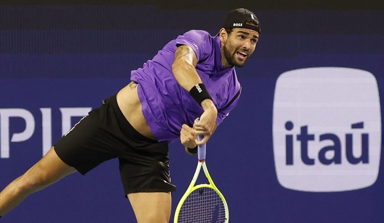 Matteo Berrettini serves against Taylor Fritz during the 2025 Miami Open.