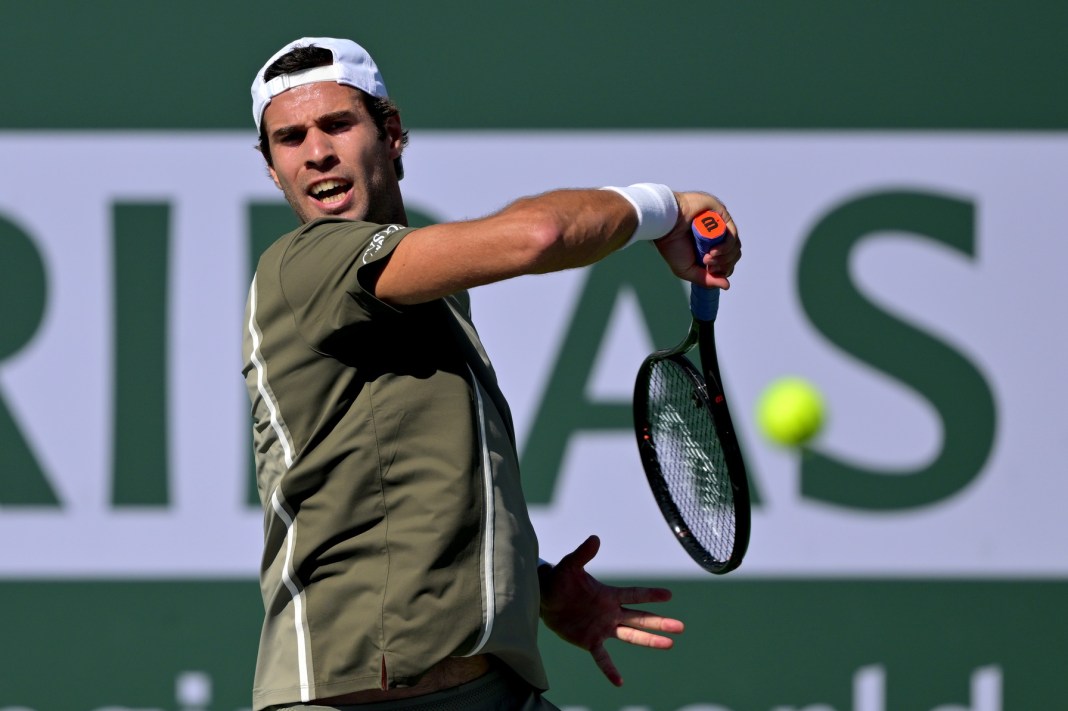 Karen Khachanov hits a forehand against Joao Fonseca at the 2026 BNP Paribas Open in Indian Wells.