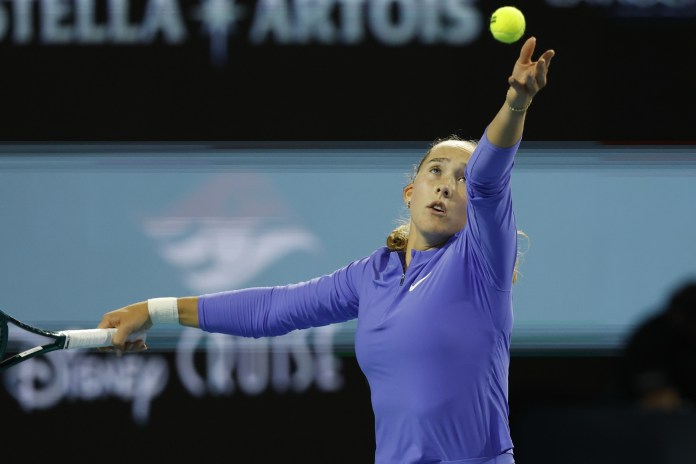 Mirra Andreeva serves against McCartney Kessler at the 2026 Miami Open.