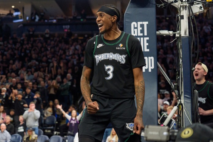 Timberwolves forward Jaden McDaniels reacts to a play against the Nuggets during the 2026-26 NBA Playoffs.