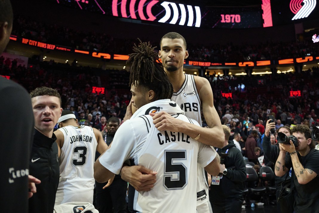 Spurs stars Victor Wembanyama and Stephon Castle celebrate a win over the Trail Blazers in the 2025-26 NBA Playoffs.