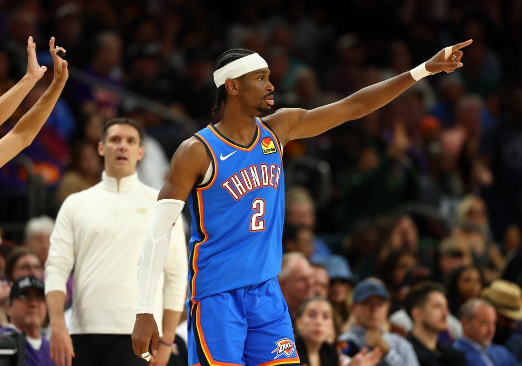 Thunder star Shai Gilgeous-Alexander points against the Suns during the 2025-26 NBA Playoffs.