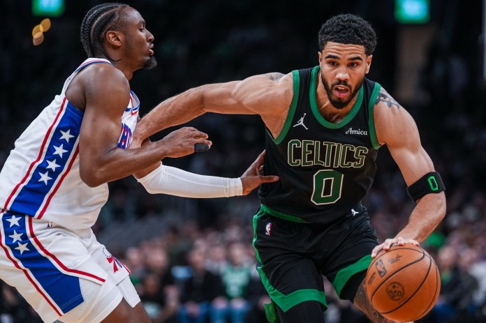 Celtics star Jayson Tatum drives on 76ers star Tyrese Maxey during the 2025-26 NBA Playoffs.