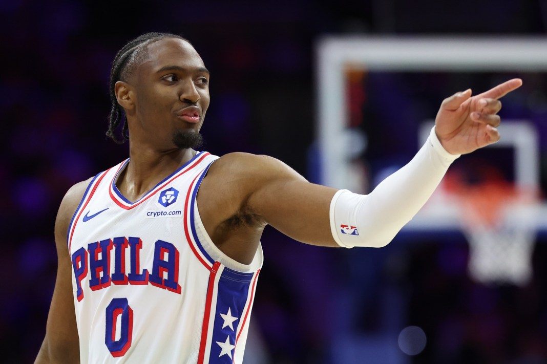 Sixers star Tyrese Maxey points against the Celtics during the 2025-26 NBA Playoffs.