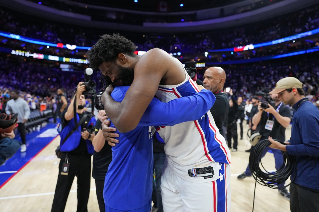 Philadelphia 76ers center Joel Embiid (21) reacts with New York Knicks guard Jalen Brunson