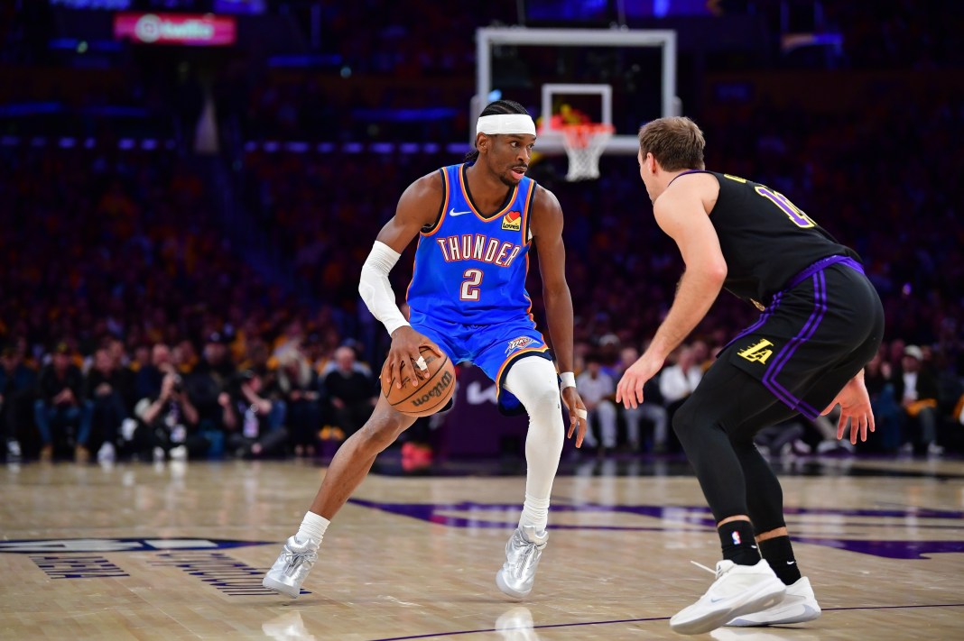 NBA: Playoffs-Oklahoma City Thunder at Los Angeles Lakers Thunder star Shai Gilgeous-Alexander drives against the Lakers during the 2025-26 NBA Playoffs.