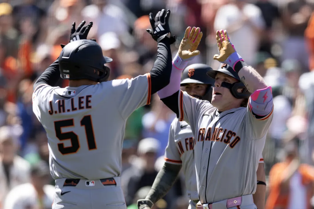 MLB: San Francisco Giants at Athletics Giants Matt Chapman celebrates with Harrison Bader during the 2026 MLB season.