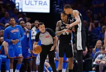 Spurs vs. Thunder Game 2 Pick: 2025-26 NBA Playoffs Predictions and Odds Spurs star Victor Wembanyama embraces Devin Vassell during Game 1 against the Thunder in the 2025-26 NBA Playoffs.