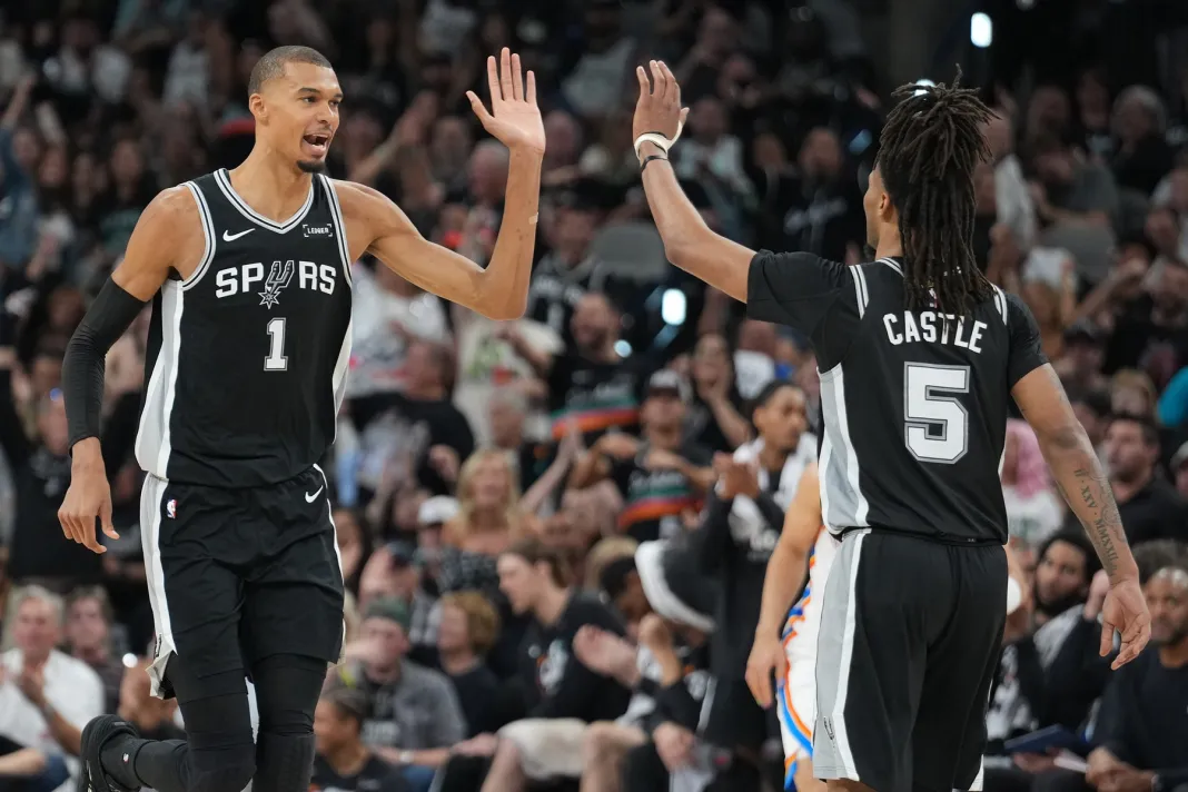 NBA: Playoffs-Oklahoma City Thunder at San Antonio Spurs Spurs stars Victor Wembanyama and Stephon Castle celebrate a play against the Thunder in the 2025-26 NBA Playoffs.