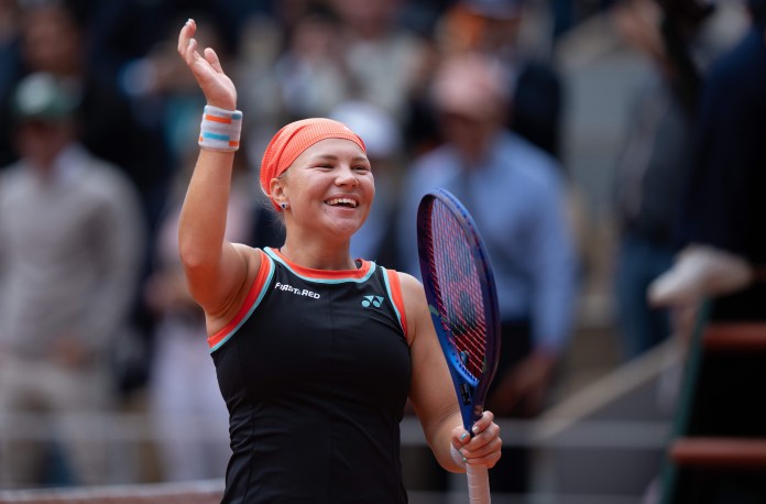 Diana Shnaider celebrates a win over Aryna Sabalenka at the 2026 French Open.