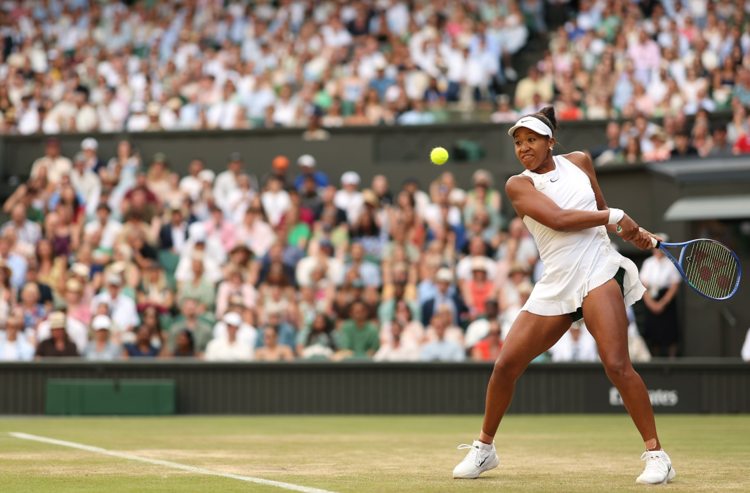 Screenshot 2026-07-06 at 9.16.35 AM Naomi Osaka hits a backhand in her match against Aryna Sabalanke at the 2026 Wimbledon Championships.