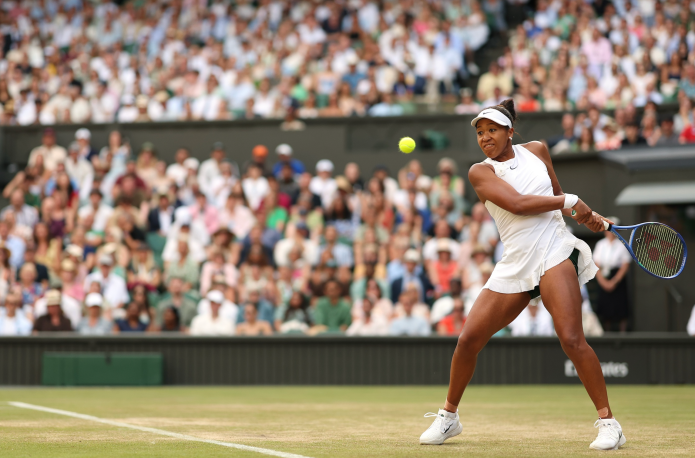 Naomi Osaka hits a backhand in her match against Aryna Sabalanke at the 2026 Wimbledon Championships.