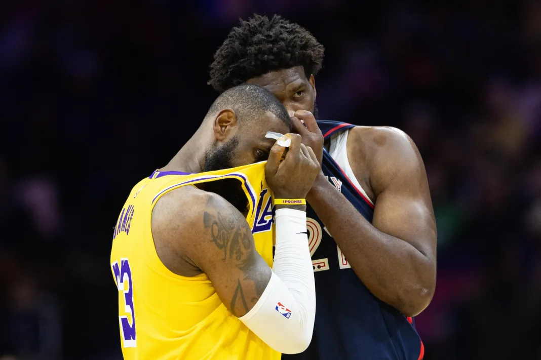 NBA: Los Angeles Lakers at Philadelphia 76ers LeBron James and Joel Embiid talk during the 2023-24 NBA season.