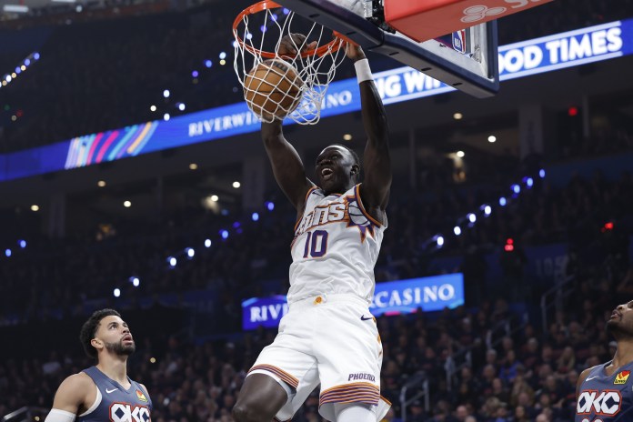 Suns center Khaman Maluach dunks against the Thunder during the 2025-26 NBA season.