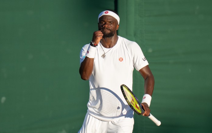 Frances Tiafoe celebrates a point at Wimbledon in 2026.