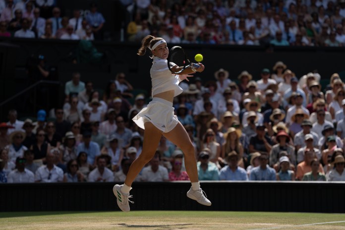 Karolina Muchova hits a forehand against Coco Gauff at the 2026 Wimbledon Championships.