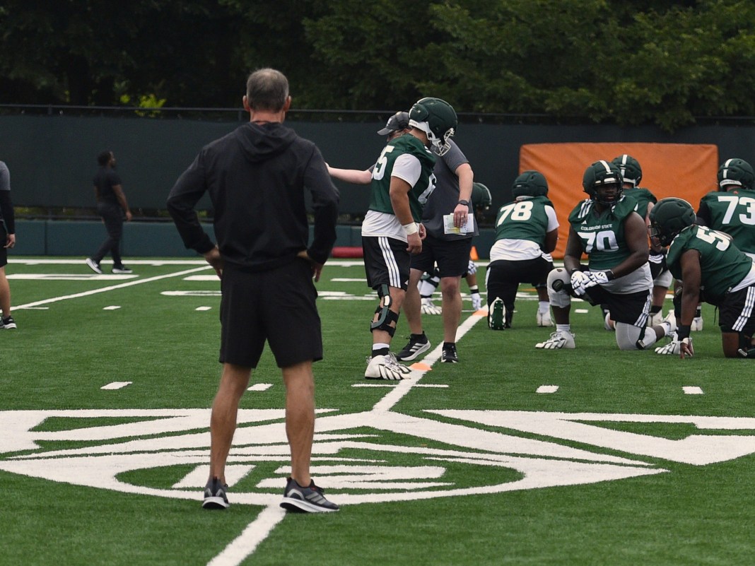 Colorado State football player Jim Mora stands on the Pac-12 logo during practice on Aug. 5, 2026. pac-12 team previews college football 2026