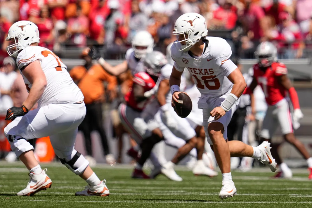 Texas Longhorns quarterback Arch Manning (16) runs during the second half of the NCAA football game against the Ohio State