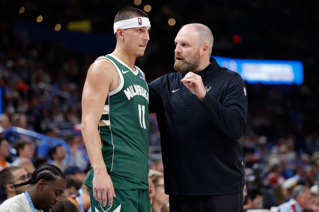 Bucks guard Tyler Herro talks to new coach Taylor Jenkins.