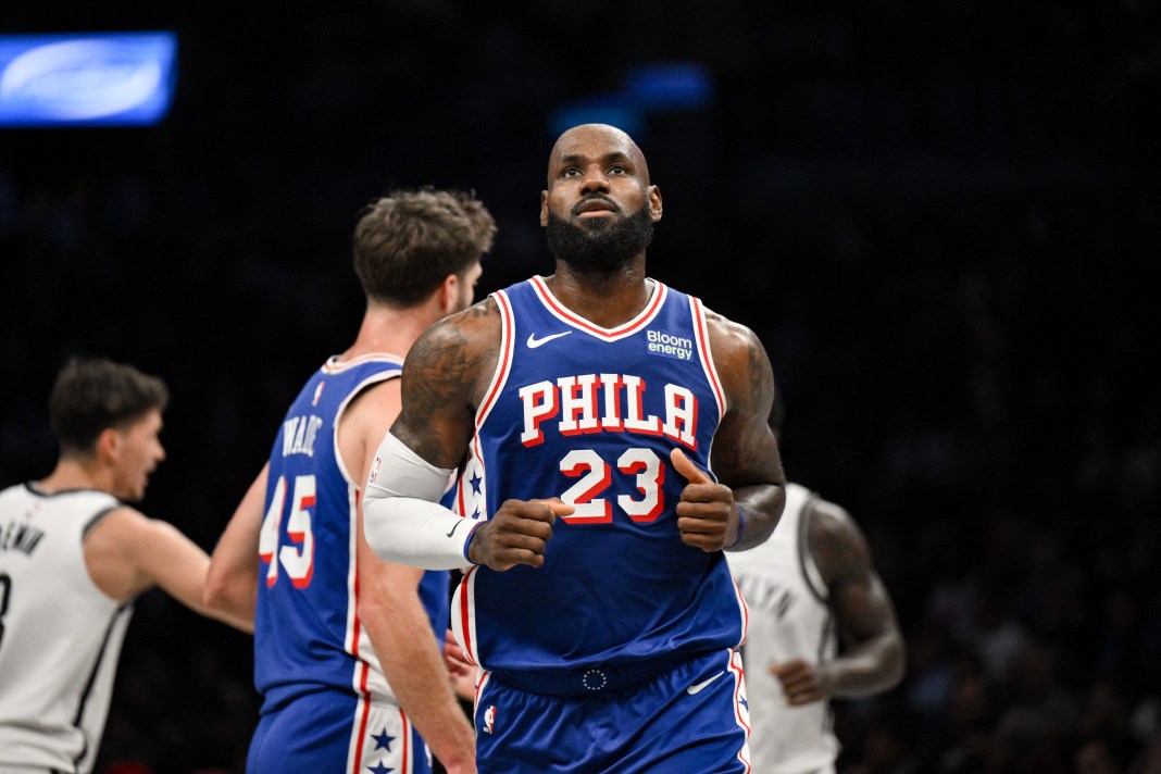 76ers star LeBron James runs the floor against the Nets in preseason.