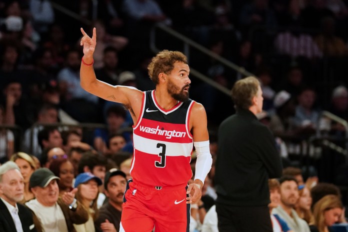 Wizards star Trae Young celebrates a shot in preseason against the Knicks.