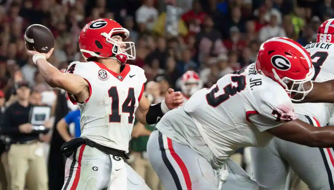 Oct 10, 2026; Tuscaloosa, Alabama, USA; Georgia quarterback Gunner Stockton (14) throws for a first down late in the fourth Gunner Stockton, Georgia, college football