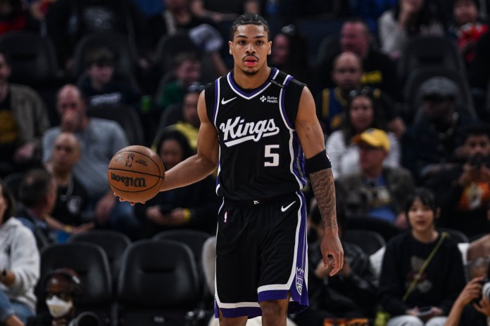 Kings guard Darius Acuff brings the ball up against the Warriors in the 2026-27 preseason.