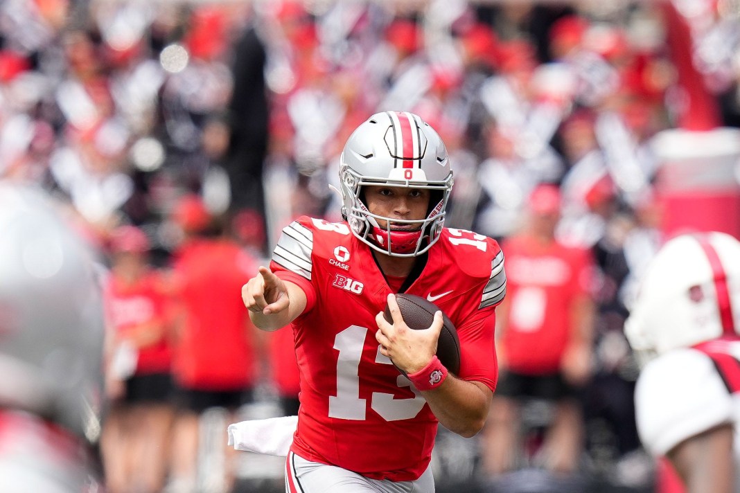 Ohio State Buckeyes quarterback Luke Fahey (13) runs the ball in the second half of the NCAA football game at Ohio Stadium on Luke Fahey