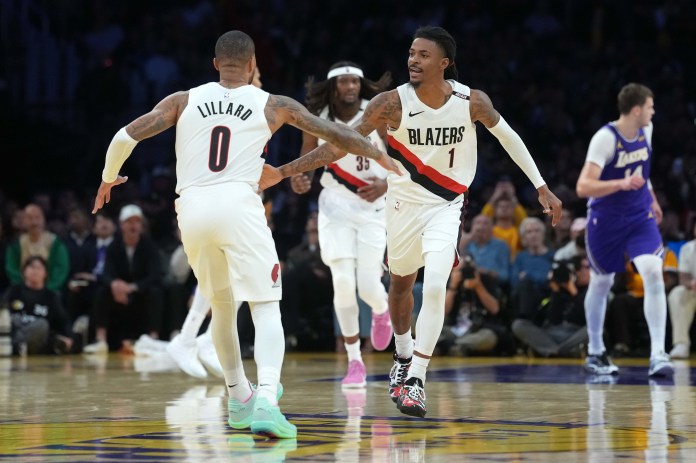 Blazers guards Damian Lillard and Ja Morant celebrate against the Lakers during the 2026-27 season.